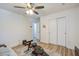 Bright bedroom features a ceiling fan, wood floors, and closet at 156 Woodward Rd, Goose Creek, SC 29445