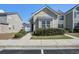 Charming two-story home with neutral siding, trimmed windows, mature hedges and landscaped walkway in front at 156 Woodward Rd, Goose Creek, SC 29445