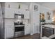 Bright kitchen with stainless steel appliances, white cabinets, subway tile backsplash, and modern oven and microwave at 156 Woodward Rd, Goose Creek, SC 29445