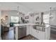Bright kitchen features white cabinets, stainless steel appliances, and a large island with a stainless steel sink at 156 Woodward Rd, Goose Creek, SC 29445