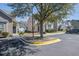 Home with neutral siding, manicured shrubs, and a view of the neighborhood street and sidewalk at 156 Woodward Rd, Goose Creek, SC 29445
