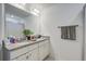 Bright bathroom with granite countertops, white cabinetry, double sinks and a large mirror at 158 Spencer Cir, Summerville, SC 29485