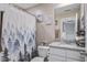 Charming bathroom featuring granite countertops, white cabinets, and a shower-tub combo at 158 Spencer Cir, Summerville, SC 29485