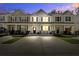 Inviting townhome with a concrete driveway and manicured lawn perfect for curb appeal at 158 Spencer Cir, Summerville, SC 29485
