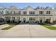 Inviting townhome with a concrete driveway and manicured lawn perfect for curb appeal at 158 Spencer Cir, Summerville, SC 29485