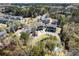 Scenic aerial view of the townhomes surrounding a pond, creating a serene living environment at 1587 Bluewater Way, Charleston, SC 29414