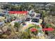 Aerial view of townhomes with pond, parking, and street markers at 1587 Bluewater Way, Charleston, SC 29414