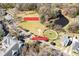 Annotated aerial view showcasing neighborhood park, playground, and surrounding green spaces and pond at 1587 Bluewater Way, Charleston, SC 29414