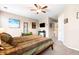 Comfortable bedroom with a ceiling fan, an access to a bathroom, and an accent wall at 1587 Bluewater Way, Charleston, SC 29414