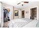 Bedroom with closet, ceiling fan, and attached bathroom and storage space at 1587 Bluewater Way, Charleston, SC 29414
