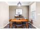 Dining area with wood table, decor, and view to other parts of the home at 1587 Bluewater Way, Charleston, SC 29414