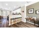 Open concept kitchen with breakfast bar, modern stools, wood flooring, and decor at 1587 Bluewater Way, Charleston, SC 29414