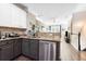 Modern kitchen with stainless steel appliances, granite countertops, and an open view to the living room at 1587 Bluewater Way, Charleston, SC 29414