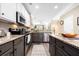 Well-appointed kitchen with granite countertops, stainless steel appliances, and modern cabinetry at 1587 Bluewater Way, Charleston, SC 29414