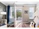 Inviting living space with hardwood floors and an open door that leads to a cozy porch at 1587 Bluewater Way, Charleston, SC 29414