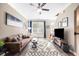 Comfortable living room featuring a plush sofa, modern decor, and ample natural light creating a warm atmosphere at 1587 Bluewater Way, Charleston, SC 29414