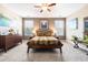 Serene main bedroom with neutral tones, large windows, and comfortable furnishings at 1587 Bluewater Way, Charleston, SC 29414