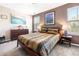 Inviting main bedroom with ample natural light, stylish decor, and comfortable bedding at 1587 Bluewater Way, Charleston, SC 29414