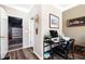 Functional office space with a modern desk, computer setup, and access to the garage at 1587 Bluewater Way, Charleston, SC 29414
