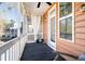 Charming screened porch with wood flooring, overhead lighting and neighborhood views at 1587 Bluewater Way, Charleston, SC 29414