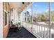 Cozy screened porch with rocking chair and view of the outdoors at 1587 Bluewater Way, Charleston, SC 29414