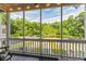Inviting screened porch with views of the surrounding trees and landscaping at 1587 Bluewater Way, Charleston, SC 29414