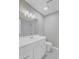 A well-lit bathroom featuring a modern vanity, stylish mirror, and patterned tile flooring at 159 Foxborough Rd, Goose Creek, SC 29445