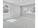 Bright, carpeted bedroom featuring ample natural light from the multiple windows at 159 Foxborough Rd, Goose Creek, SC 29445