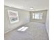 Bright bedroom with neutral walls and carpet, and windows letting in natural light at 159 Foxborough Rd, Goose Creek, SC 29445