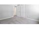 A modern, carpeted bedroom with crisp white trim and a doorway leading to additional rooms at 159 Foxborough Rd, Goose Creek, SC 29445