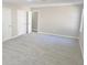 Spacious bedroom with neutral carpet, light walls, closet, and entry door at 159 Foxborough Rd, Goose Creek, SC 29445
