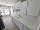 Bright kitchen featuring white cabinets, subway tile backsplash, new appliances, and quartz countertops at 159 Foxborough Rd, Goose Creek, SC 29445
