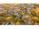 A high angle aerial shot reveals the neighborhood's design, mature landscaping and winding streets at 171 Cartright St, Charleston, SC 29492