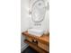 Modern bathroom with wood vanity, sleek sink, and decorative mirror at 171 Cartright St, Charleston, SC 29492