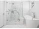 Sleek bathroom with a soaking tub, glass shower, and marble tile at 171 Cartright St, Charleston, SC 29492