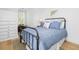 Bedroom features natural light, blue bedding, nautical decor and hardwood floors at 171 Cartright St, Charleston, SC 29492