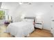 Bright bedroom features natural light, white walls, ceiling fan and hardwood floors at 171 Cartright St, Charleston, SC 29492