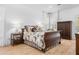 Comfortable bedroom with a king-size bed, wood floors, shuttered windows, and decorative bedside table at 171 Cartright St, Charleston, SC 29492
