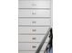 Close up of a white chest of drawers with metallic pulls in bedroom at 171 Cartright St, Charleston, SC 29492