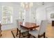 Bright dining room with hardwood floors, wainscoting and a sophisticated chandelier at 171 Cartright St, Charleston, SC 29492