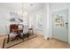 Elegant dining room with wood floors, plantation shutters and stylish lighting at 171 Cartright St, Charleston, SC 29492