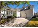 Traditional home featuring an attached two-car garage and well-maintained landscaping at 171 Cartright St, Charleston, SC 29492