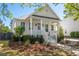 Attractive home with a classic design, front porch, and vibrant landscaping at 171 Cartright St, Charleston, SC 29492