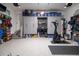 Well-organized garage with epoxy floors, storage cabinets, fitness equipment, and tool racks at 171 Cartright St, Charleston, SC 29492
