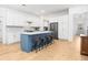 Bright kitchen featuring a marble top island with barstool seating and stainless steel appliances at 171 Cartright St, Charleston, SC 29492