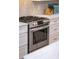Stainless steel gas range and oven with white cabinets and marble countertop at 171 Cartright St, Charleston, SC 29492