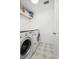 Functional laundry room with washer, dryer, and patterned flooring at 171 Cartright St, Charleston, SC 29492