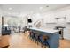 Open-concept living room and kitchen featuring an island with barstool seating at 171 Cartright St, Charleston, SC 29492