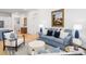 Open-concept living room with modern furnishings and decor with wood flooring and natural light at 171 Cartright St, Charleston, SC 29492