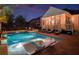 Relaxing backyard pool area featuring sun loungers, a covered porch, and serene ambiance for ultimate relaxation at 171 Cartright St, Charleston, SC 29492